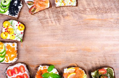 Background of Nordic open sandwiches. Background of scandinavian open sandwiches. Free space for your text.