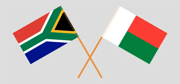 Banderas cruzadas de Madagascar y la RSA — Archivo Imágenes Vectoriales