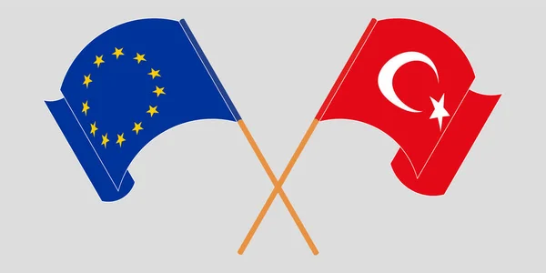 Bandeiras cruzadas e onduladas da Turquia e da UE — Vetor de Stock