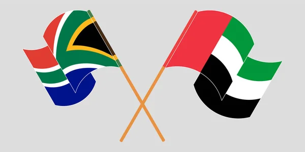 Banderas cruzadas y ondeantes de RSA y los Emiratos Árabes Unidos — Archivo Imágenes Vectoriales
