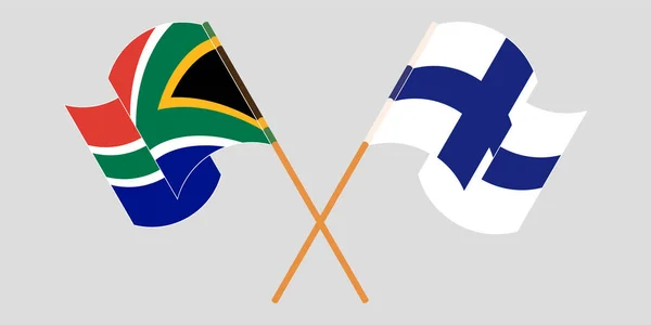 Drapeaux croisés et agités de l'Afrique du Sud et de la Finlande — Image vectorielle