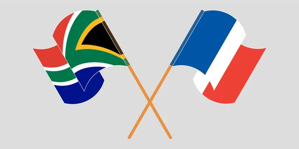 Drapeaux croisés et agités de l'Afrique du Sud et de la France — Image vectorielle
