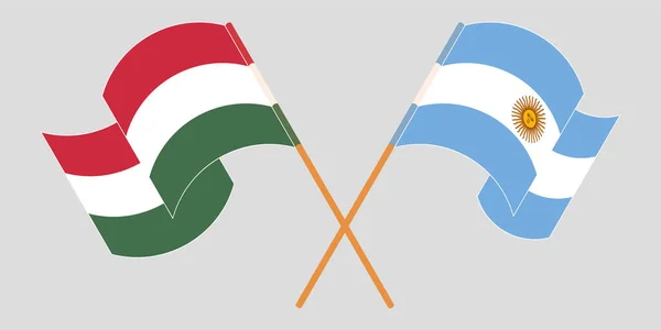 跨越并挥动匈牙利和阿根廷的国旗 — 图库矢量图片