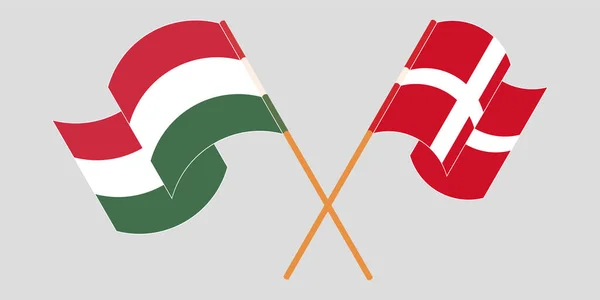 Banderas cruzadas y ondeando de Hungría y Dinamarca — Archivo Imágenes Vectoriales