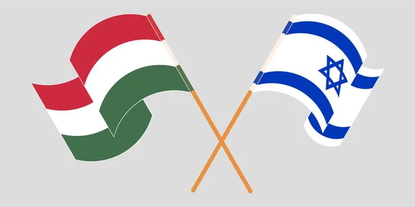 Drapeaux croisés et agités de la Hongrie et d'Israël — Image vectorielle