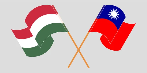 Bandeiras cruzadas e onduladas da Hungria e de Taiwan — Vetor de Stock