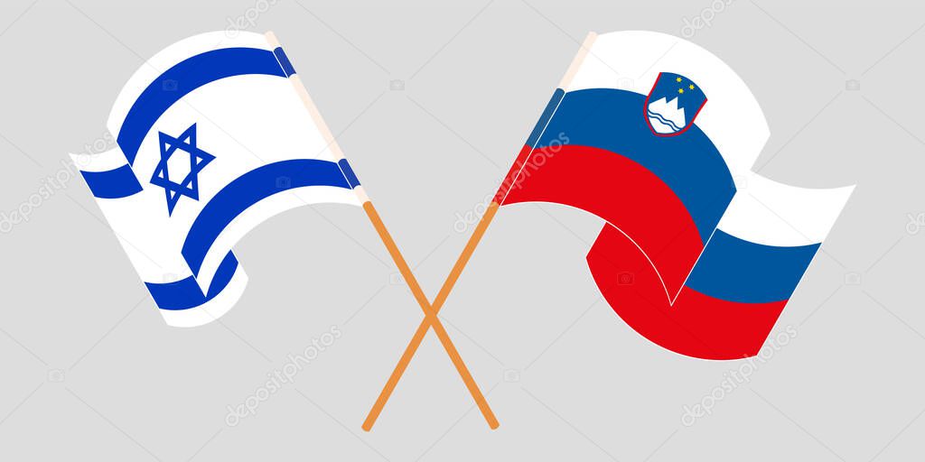 Crossed and waving flags of Slovenia and Israel
