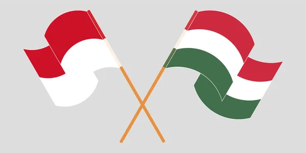 Crossed and waving flags of Indonesia and Hungary — Stock Vector
