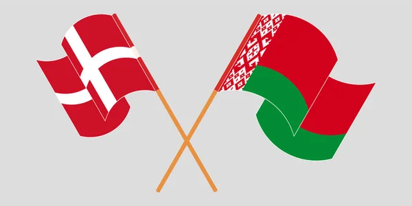 Korsade och viftande flaggor från Vitryssland och Danmark — Stock vektor