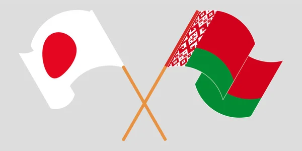 Banderas cruzadas y ondeando de Bielorrusia y Japón — Vector de stock