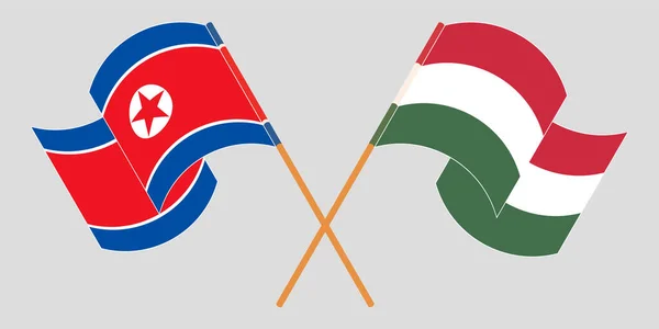 Перехрещені та розмахуючі прапори Північної Кореї та Угорщини — стоковий вектор