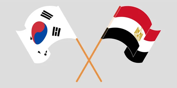 Bandeiras cruzadas e onduladas do Egito e da Coreia do Sul — Vetor de Stock