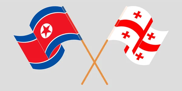 Křížené a vlnící se vlajky Gruzie a Severní Koreje — Stockový vektor
