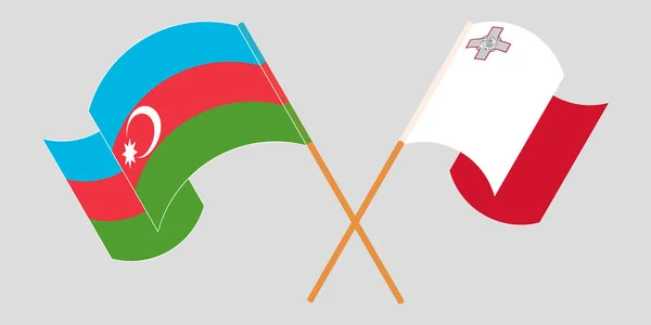 Banderas cruzadas y ondeando de Malta y Azerbaiyán — Vector de stock