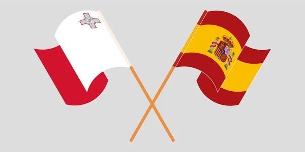 Málta és Spanyolország keresztezett és lengő lobogói — Stock Vector