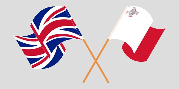 Korsade och vinkande flaggor från Malta och Förenade kungariket — Stock vektor