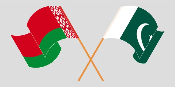 Banderas cruzadas y ondeando de Pakistán y Bielorrusia — Vector de stock