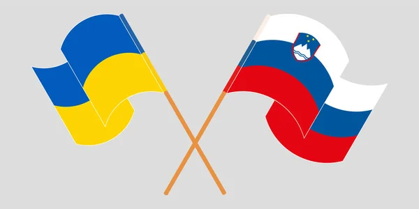 Gekruiste en wapperende vlaggen van Oekraïne en Slovenië — Stockvector