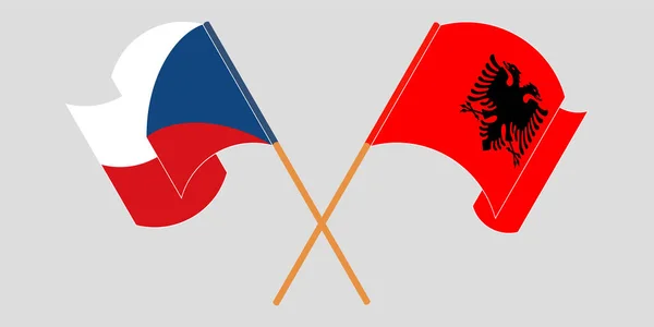Перехрещені і розмахуючи прапорами Албанії та Чехії — стоковий вектор