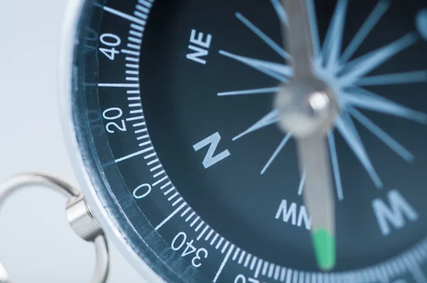 Compass on the grey background. Macro. — Stock Photo, Image