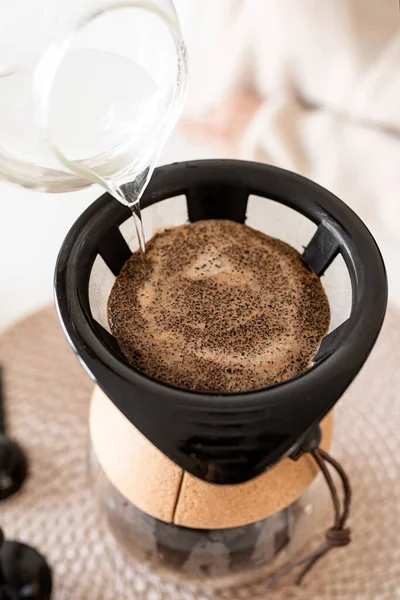 Alternative coffee brewing. Close up of coffee brewed in coffee pot