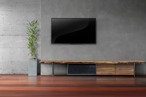 Oturma odasında tv beton duvara ile ahşap masa led