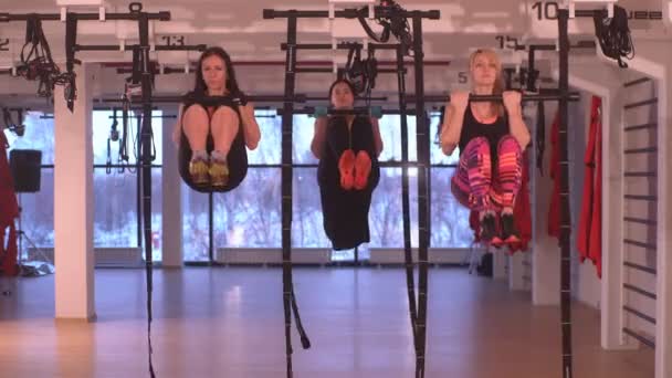 Three  girls doing exercise in fitness room — Stock Video