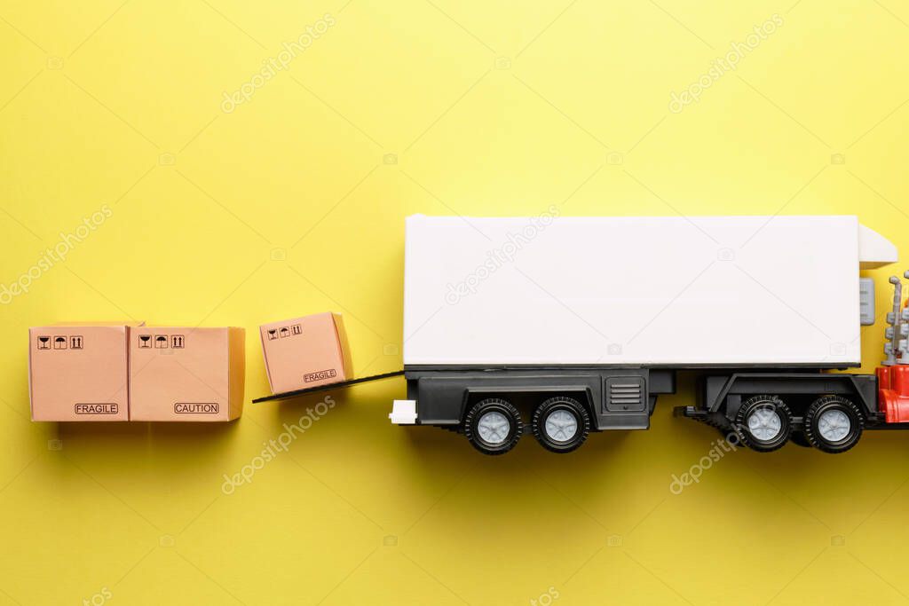 Abstract truck of a courier company unloads goods