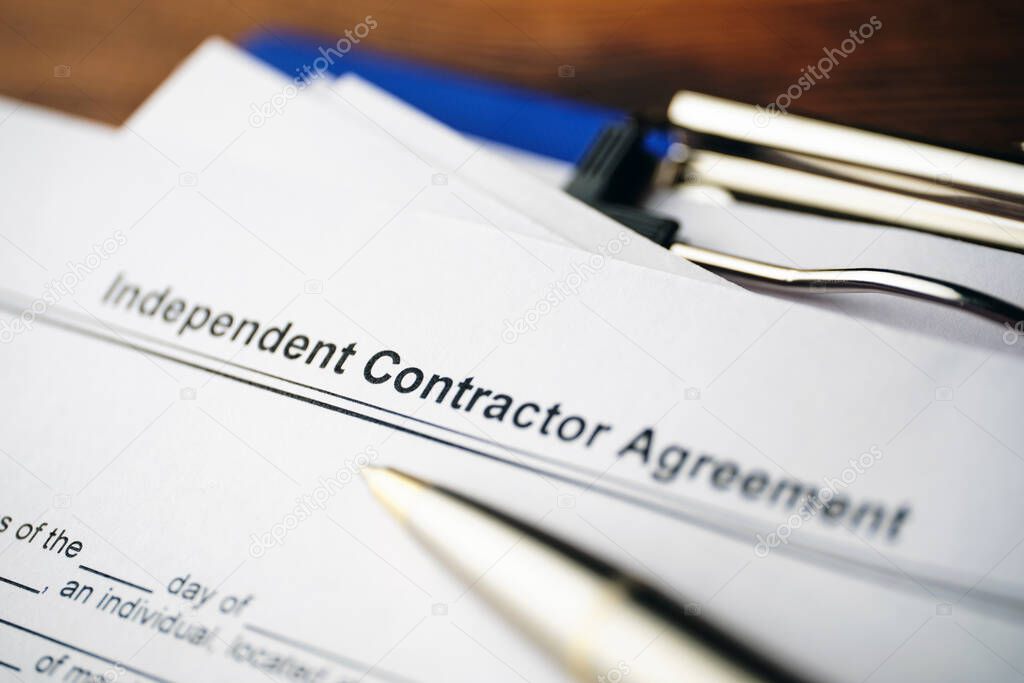 Legal document Independent Contractor Agreement on paper close up.