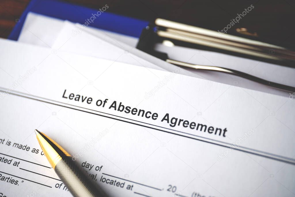 Legal document Leave of Absence Agreement on paper close up.