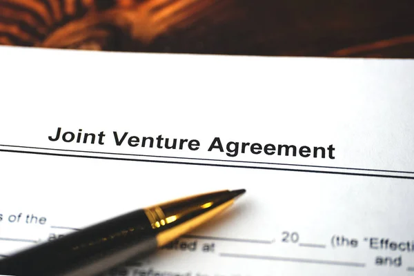 Legal document Joint Venture Agreement on paper close up