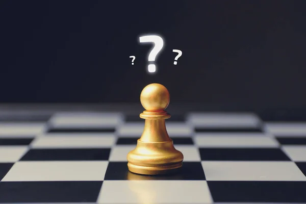 Confusion concept with question marks above a chess piece.