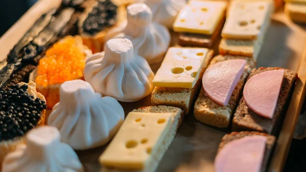 Handmade aromatic soap in the shape of food and sandwiches lies for sale in the store.