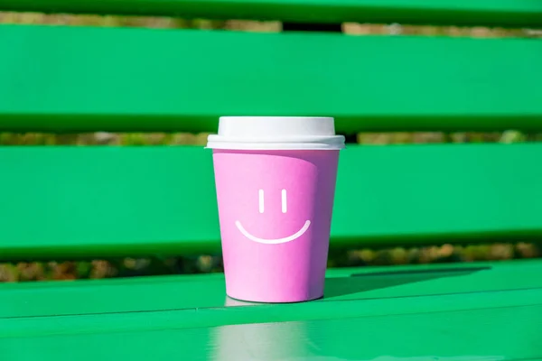 Concept of good mood and positive with smiley face on a cup of disposable coffee — 스톡 사진