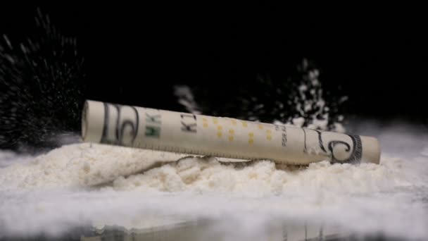 Cocaine with falling rolled up dollar — Stock Video