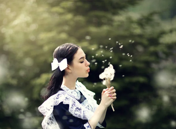 Schoolgirl Blows Dandelion — Stock Photo, Image