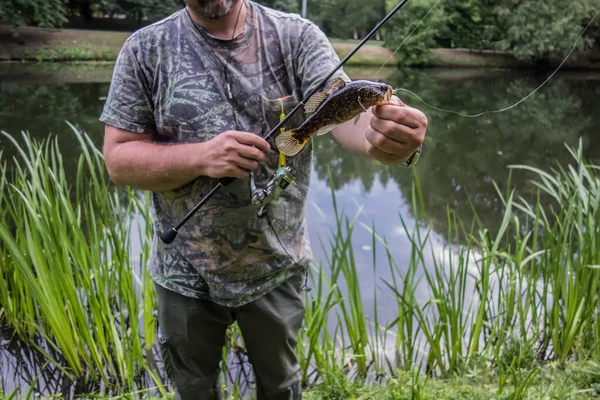 Hunting and fishing, men's hobby. Sport fisherman holding trophy fish