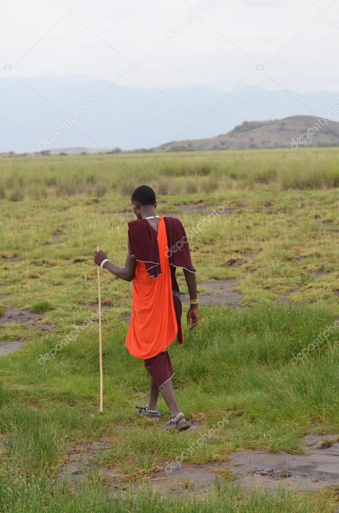 Maasai guide walking through   Lake Natron in Tanzania