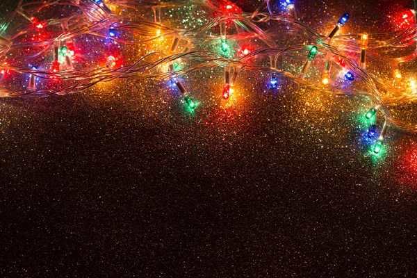 Julbelysning krans bakgrund — Stockfoto