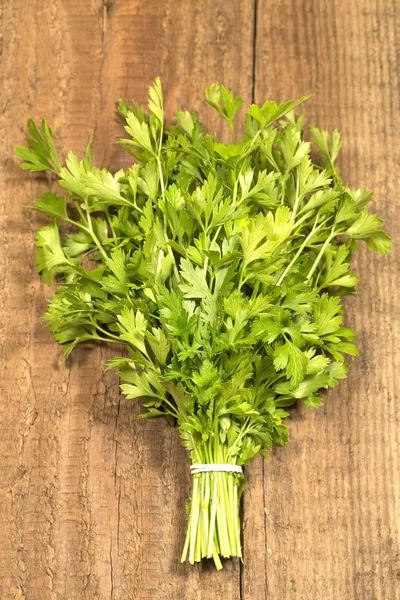 Green parsley on wooden background — Stock Photo, Image