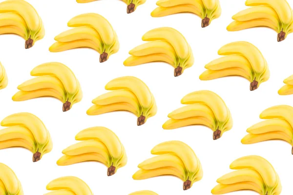 白で隔離されたバナナのパターンの束 — ストック写真