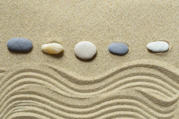 Zen garden with stones and sand pattern