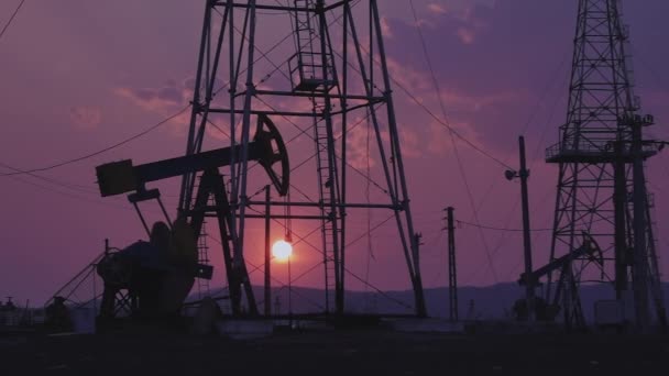 Silhouettes Oil Wells Pumping Sunset — Stock Video