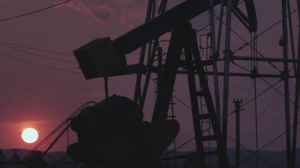 Silhouettes Oil Wells Pumping Sunset — Stock Video