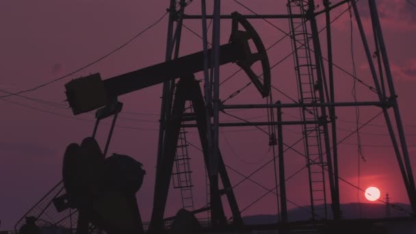 Silhouettes Oil Wells Pumping Sunset — Stock Video