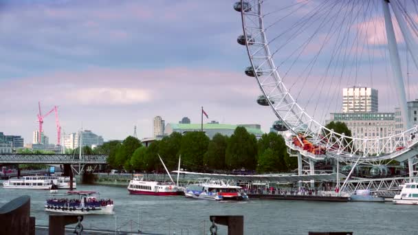 LONDON : London skyline with London Eye on Thames river in a cloudy day in London, UK. London Eye is the tallest Ferris wheel in Europe at 135 meters. ULTRA HD 4K, REAL TIME
