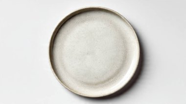 white empty round plate on a black background