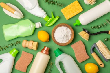Eco cleaning.Cleaning products on a textured background. Eco-friendly home cleaning. A bottle of natural detergent surfaces, eco brushes, sponges, and rags. Cleaner concept.Cleaning supplies.Flat lay.