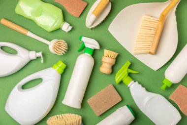 Eco cleaning.Cleaning products on a textured background. Eco-friendly home cleaning. A bottle of natural detergent surfaces, eco brushes, sponges, and rags. Cleaner concept.Cleaning supplies.Flat lay.