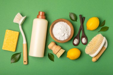 Eco cleaning.Cleaning products on a textured background. Eco-friendly home cleaning. A bottle of natural detergent surfaces, eco brushes, sponges, and rags. Cleaner concept.Cleaning supplies.Flat lay.